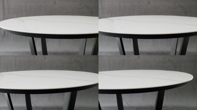 孤立灰色背景上的简约白色餐桌。