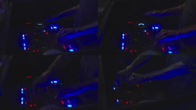 在俱乐部酒吧举行的大型聚会上，DJ按下按钮并在转盘调音台上刮擦的4k电影慢动作镜头。