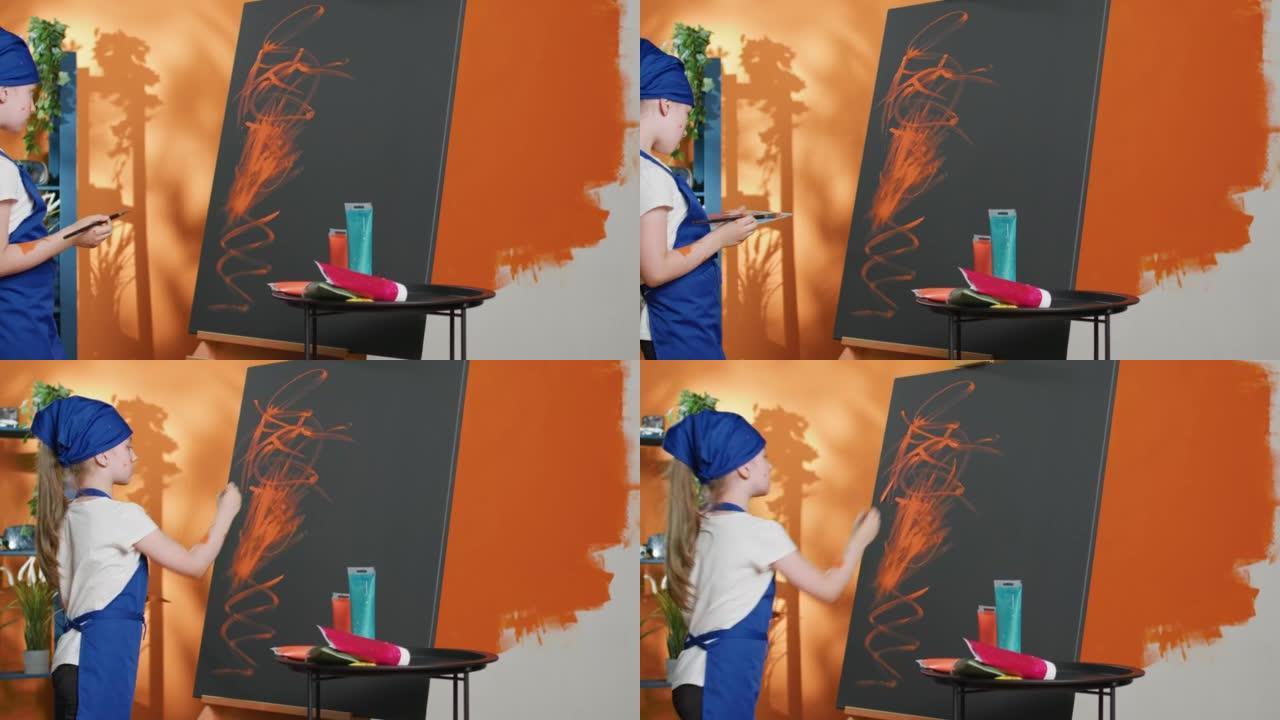 小孩子用刷子和水彩调色板画艺术品