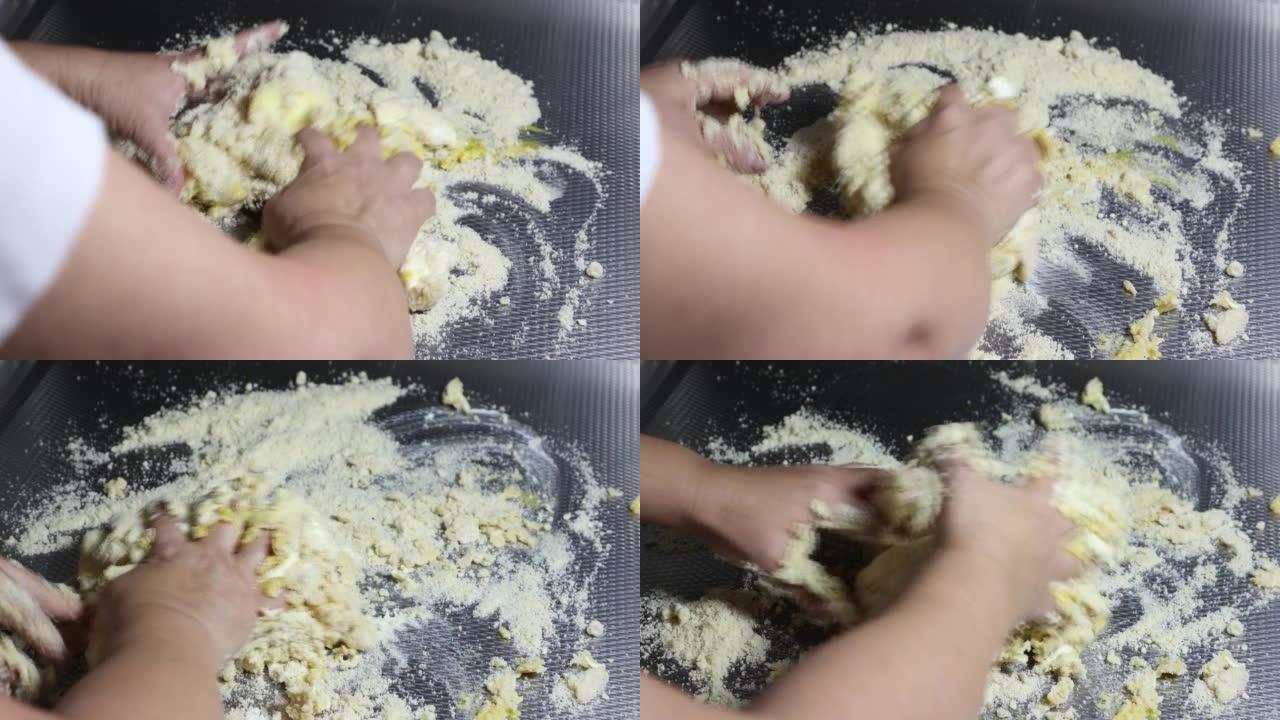 女性手开始融合杏仁粉，马苏里拉奶酪，鸡蛋，奶油奶酪和发酵粉