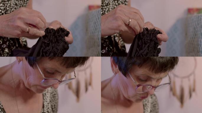 女奶奶做修理衣服缝孔衣服用针线