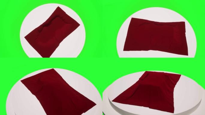 领奖台绿色屏幕上的红色织物车罩