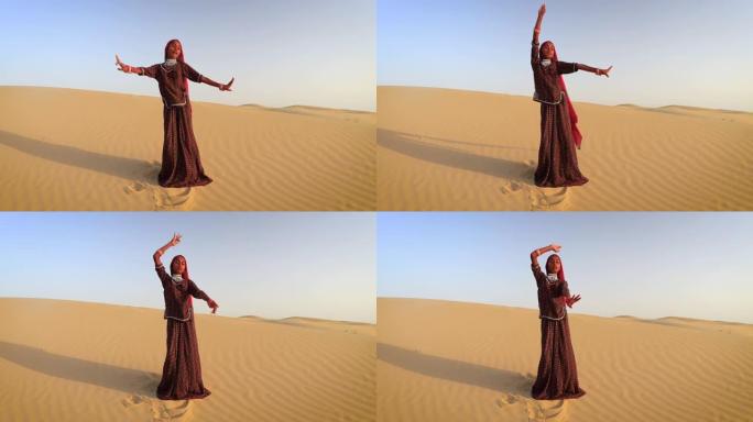 印度沙漠村，快乐的印度女孩在沙丘上跳舞
