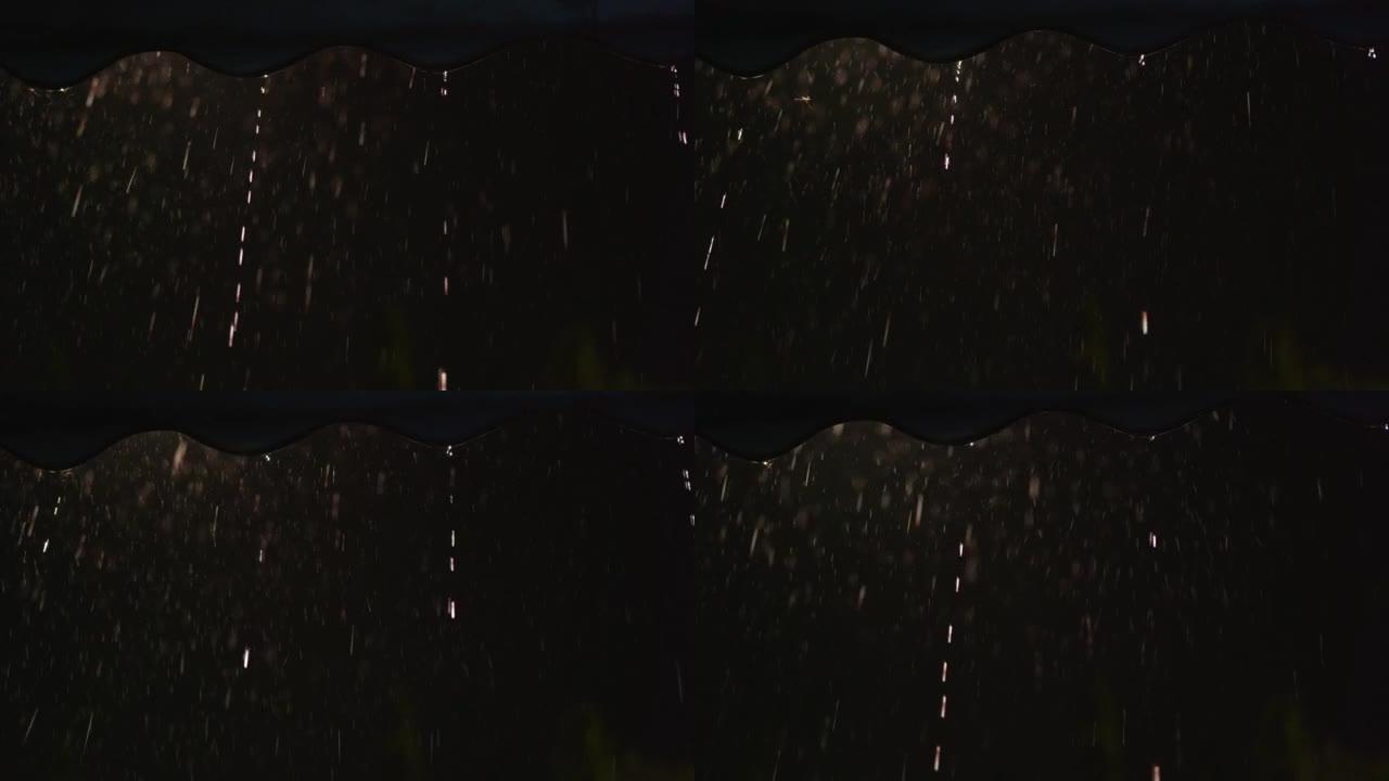 拍摄正在下雨，专注于雨水冻结在屋顶上，并在模糊的雨水背景下缓慢下降。