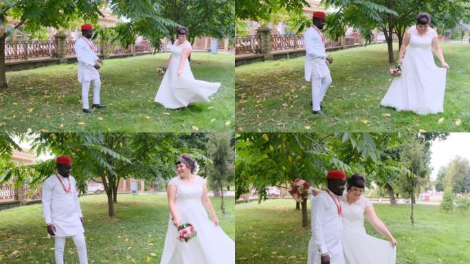 非洲新郎和高加索新娘跨种族婚礼的婚礼步行