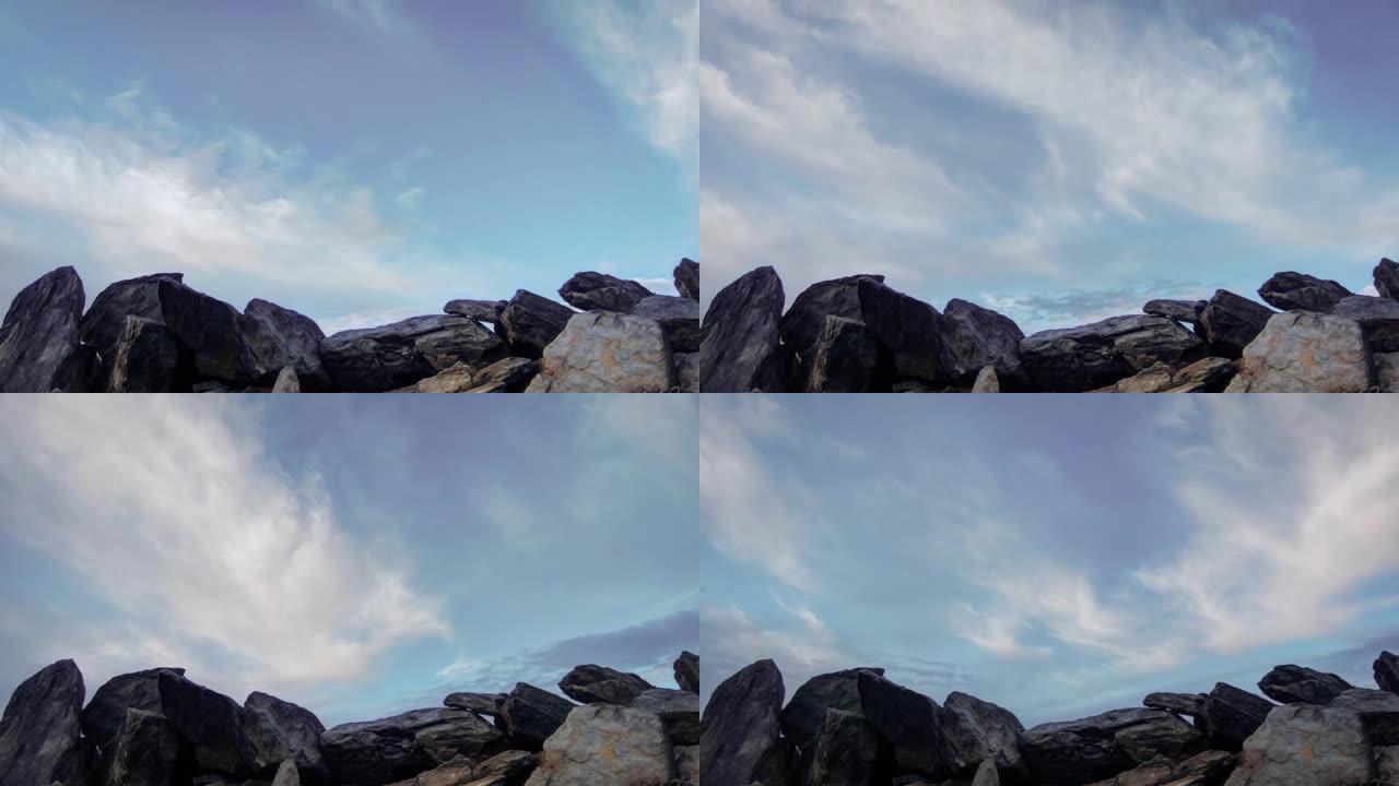 在多岩石的海岸上移动云层的延时镜头