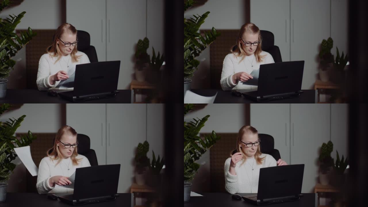 心烦意乱的白人金发女性坐着扔工作文件，关上桌子上的笔记本电脑