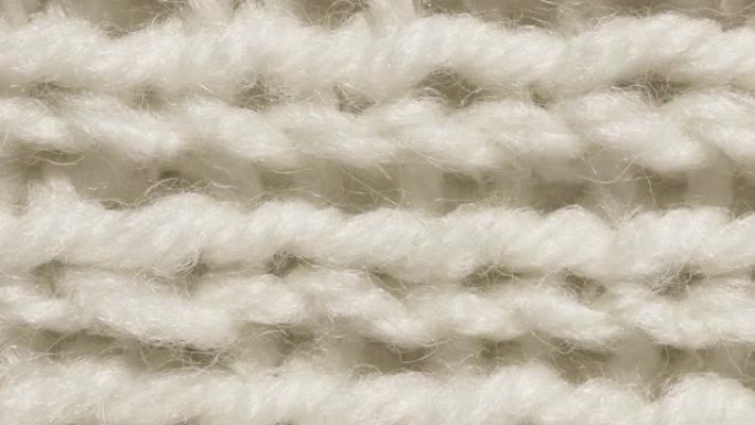 白色羊毛针织纹理无缝环。横向编织钩针详细的行。毛衣纺织背景。宏观特写。