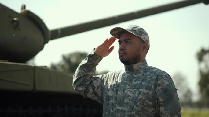 身着军装的特种部队士兵在执行外勤任务时，站在对面敬礼。在战争状态下，身着军装的军队守卫者站在主战坦克