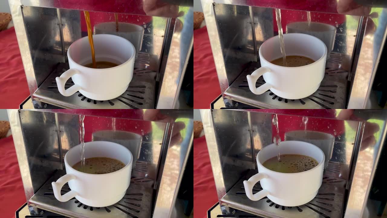 将黑色芳香令人振奋的美式咖啡倒入杯子中，用自动咖啡机煮咖啡的过程