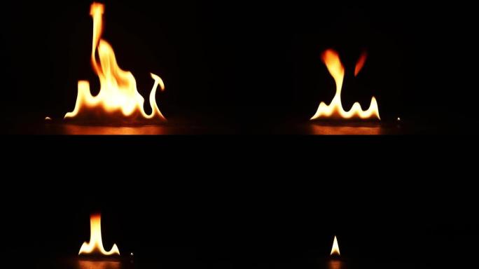 火焰点燃并燃烧。真正的火焰在黑色背景上点燃。火焰燃烧慢动作的特写镜头。