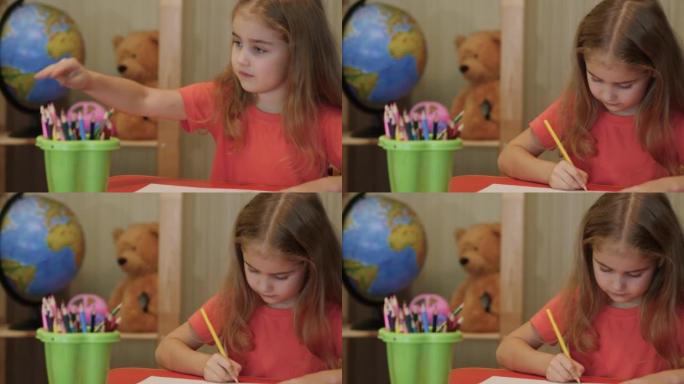 高加索女孩在纸上玩有趣的铅笔画，富有创造力和艺术性。特写肖像儿童用彩色铅笔在纸上画画。可爱的小女孩坐