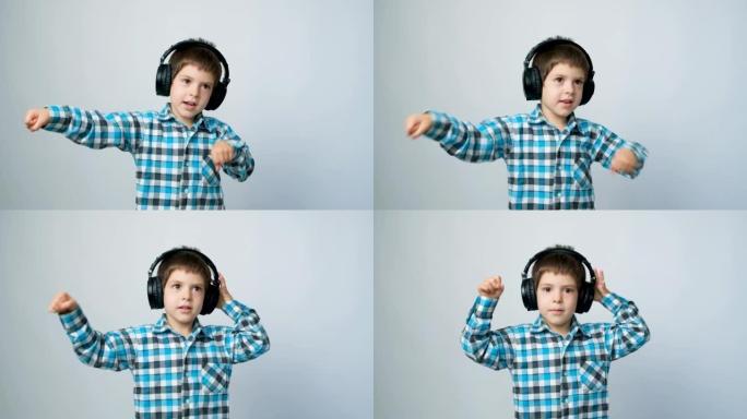 5岁的孩子戴着耳机跳舞，看着白色背景上的相机