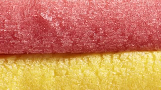 黄色浅红色泡泡糖纹理环。新鲜软糖美味背景。美味的背景。宏观特写。