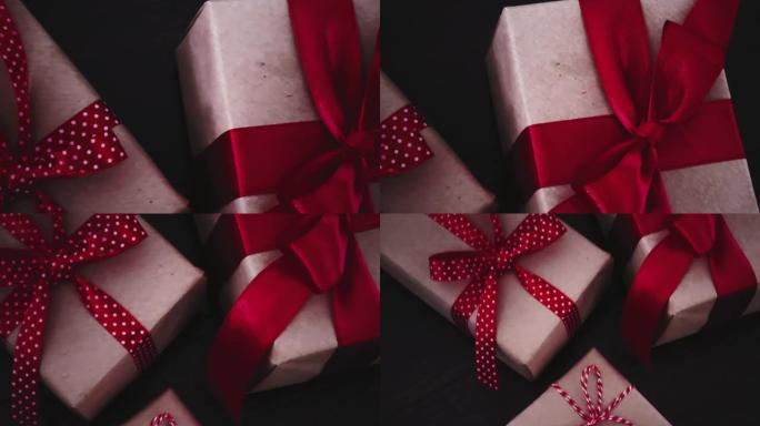 圣诞礼物和传统节日礼物，木制背景上的经典圣诞礼品盒，用红丝带工艺纸包裹的礼物，季节性节日的复古乡村风