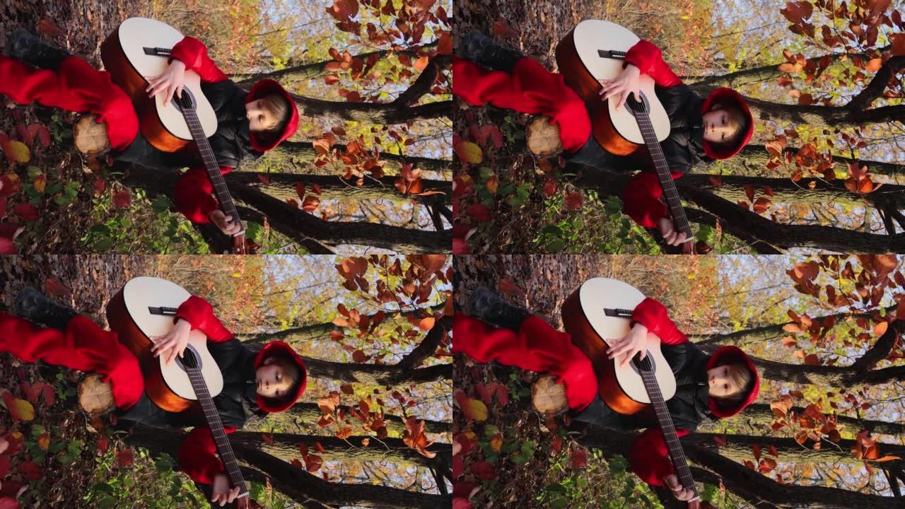 秋天公园里的男孩在红叶的背景下