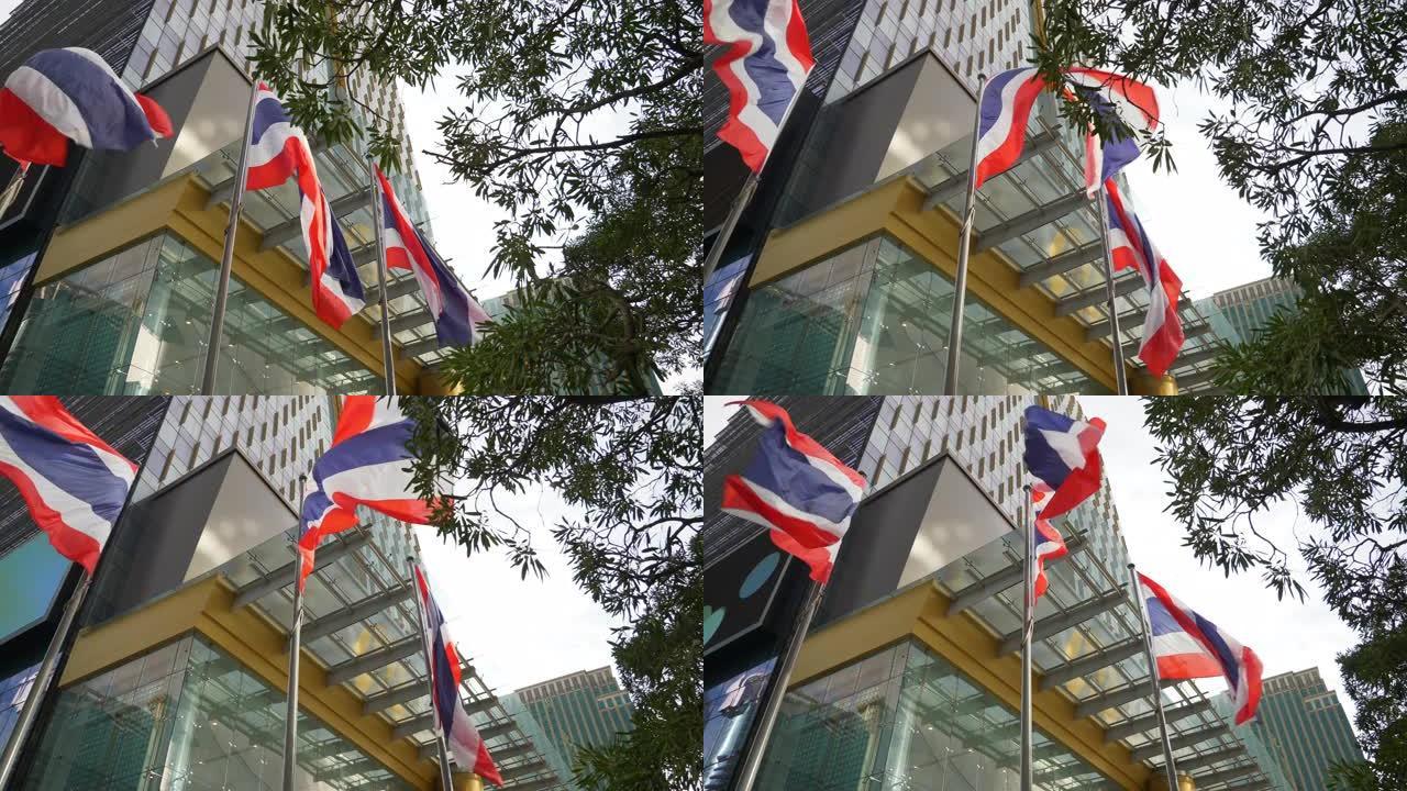 曼谷市中心日间国旗在泰国4k前慢动作全景上挥舞