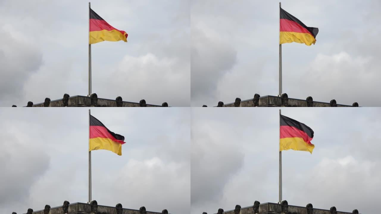 一面悬挂在旗杆上的德国国旗在风中缓缓飘扬。