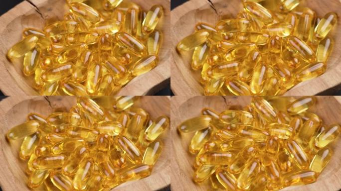欧米茄3鱼油黄金胶囊在木制乡村碗特写