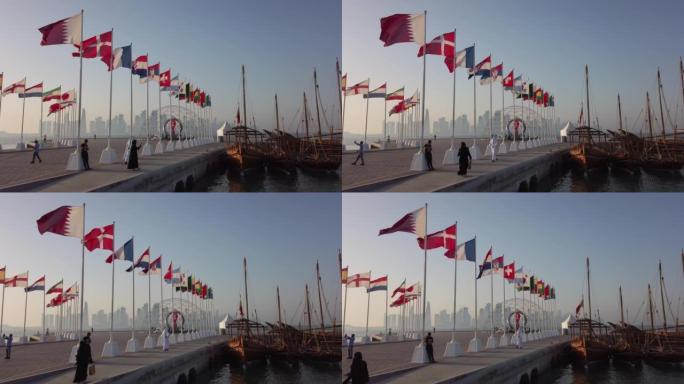 在卡塔尔多哈康沃尔长廊的 “通往世界杯的道路” 上，旗帜以慢动作挥舞