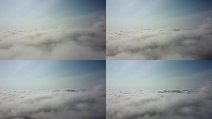 飞越云层。通过飞机窗口查看。乘飞机旅行。