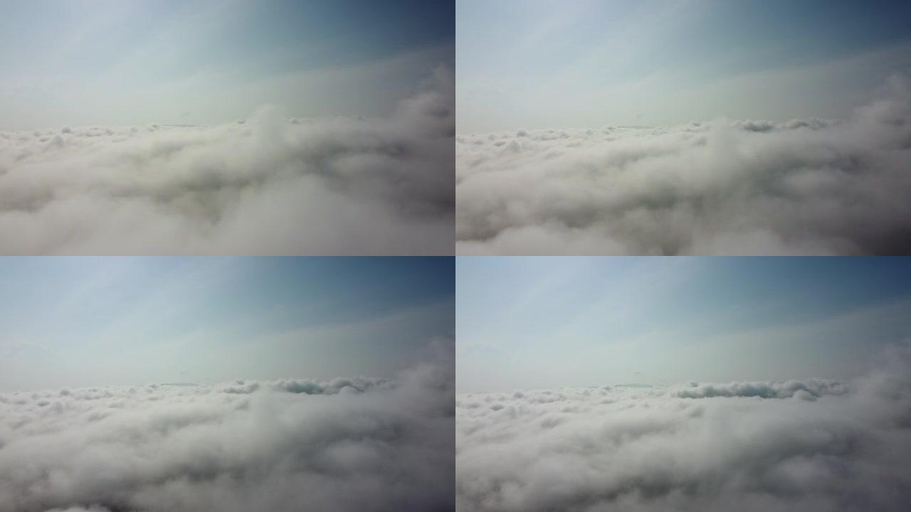 飞越云层。通过飞机窗口查看。乘飞机旅行。