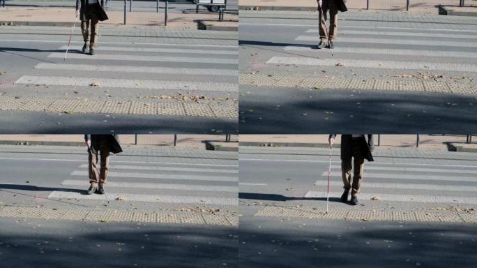 孤独的盲人探测触觉瓷砖，走到行人横穿安全道路