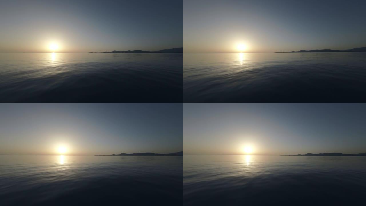 x5夏季在爱琴海用帆船在日出时航行的慢动作镜头