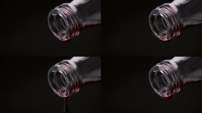 特写红酒滴落从瓶颈在超慢动作特写。