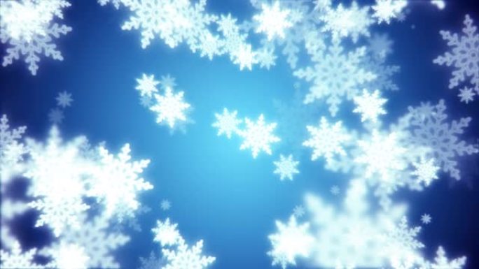 美丽的节日蓝色圣诞新年雪花闪耀着飘落的光芒，模糊效果和蓝色背景上的散景。摘要背景。屏幕保护程序，高质