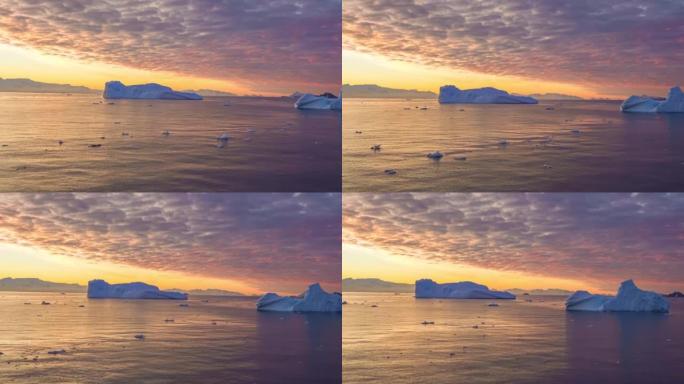 在南极半岛Cierva Cove冰川景观前的南极游轮上梦幻般的日落