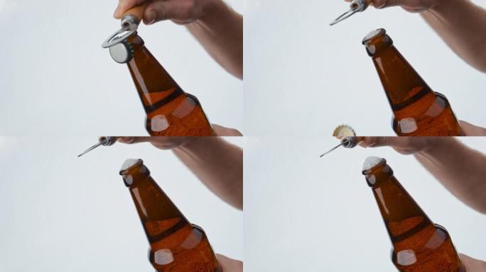 用开瓶器打开啤酒瓶的男子用超慢动作特写。