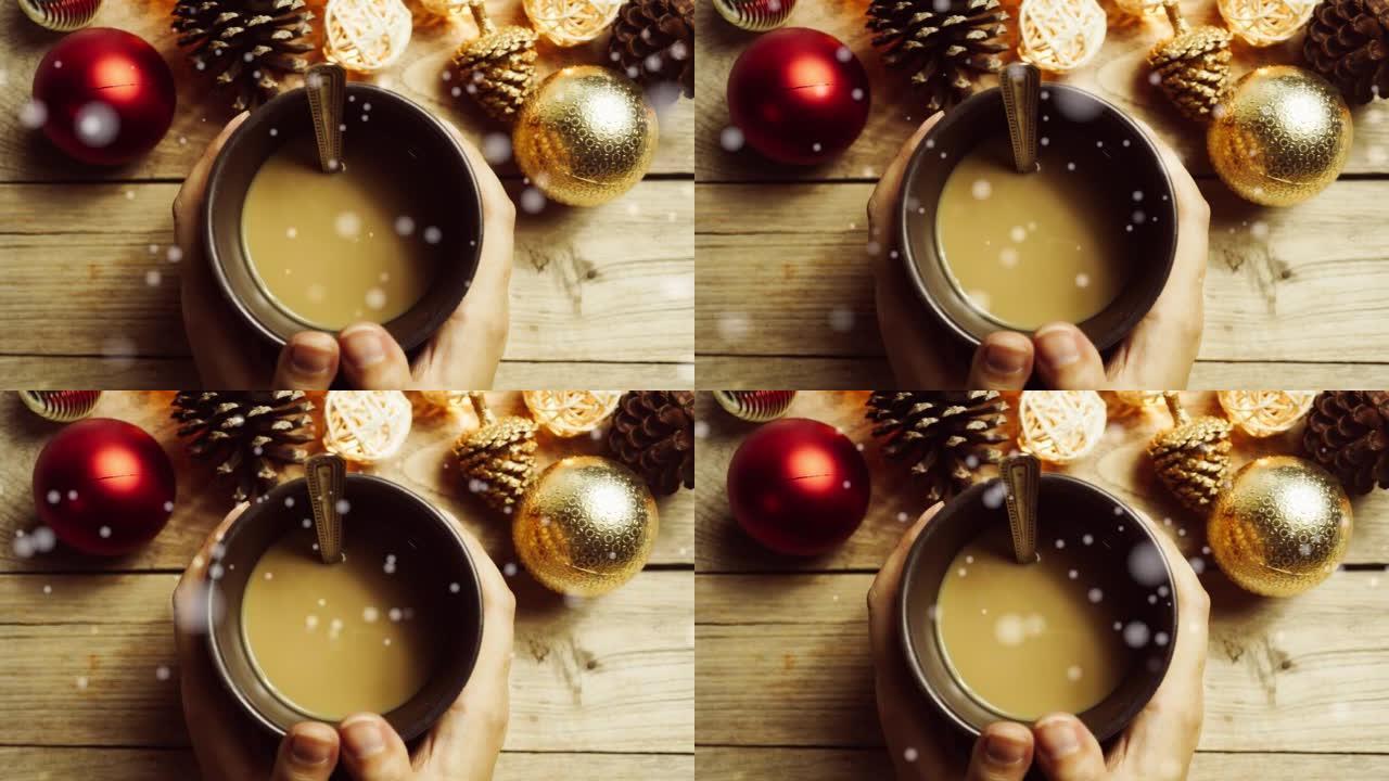 圣诞装饰品、手和咖啡杯