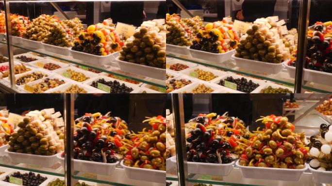 圣米格尔市场旅游市中心的各种橄榄烤串和美味菜肴布局展示
