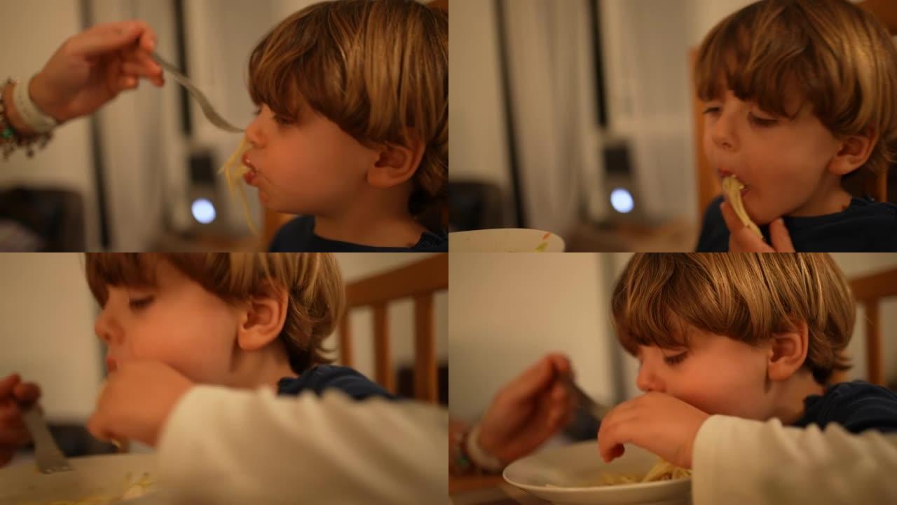 孩子随地吐食。一个小男孩不想吃意大利面。孩子吐口水晚餐