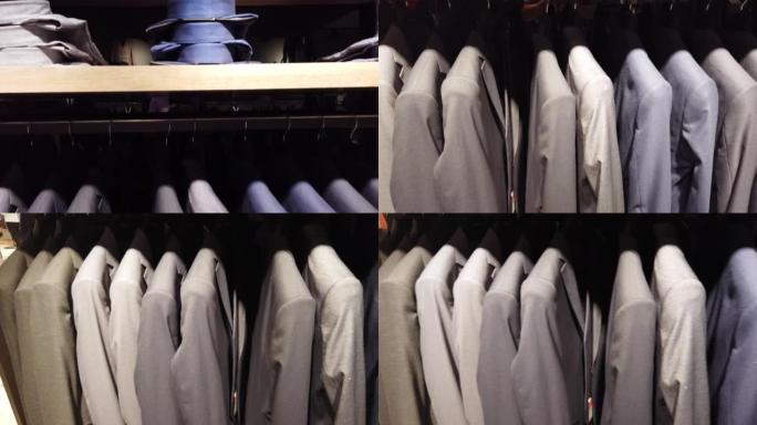 销售男士西装、裤子、衬衫和配饰的部门。现代购物中心的购物概念。