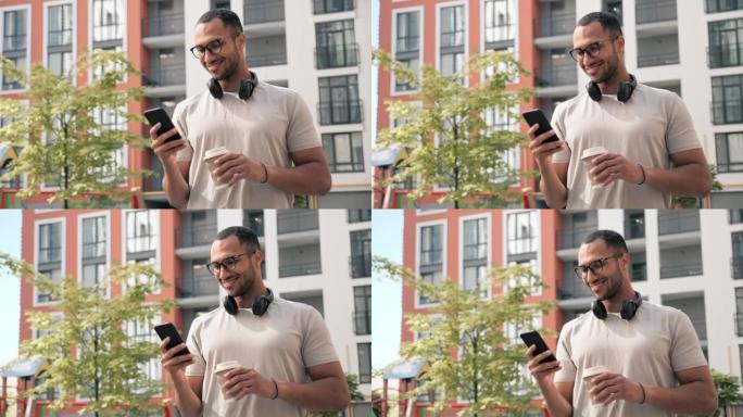 英俊的拉丁裔男子自由职业者客户端家伙在眼镜上使用智能手机浏览滚动点击书写信息观看视频聊天应答移动呼叫