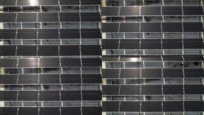 大型企业办公室屋顶上的太阳能电池板和绿色能源装置的图案和成排，为整个建筑物供电