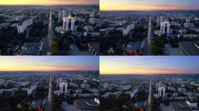 摩尔多瓦基希讷乌傍晚的空中无人机视图。具有总统和议会，多个建筑物，道路，照明的市中心视图