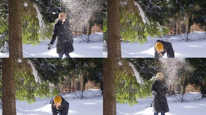 可爱的年轻女子喜欢在冬季自然森林中嬉戏地扔雪