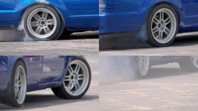 漂移汽车在速度轨道上燃烧轮胎。
