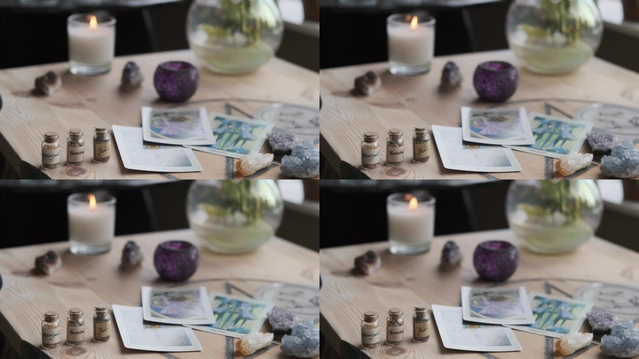 桌子上有塔罗牌，水晶，草药和吹蜡烛的4k镜头