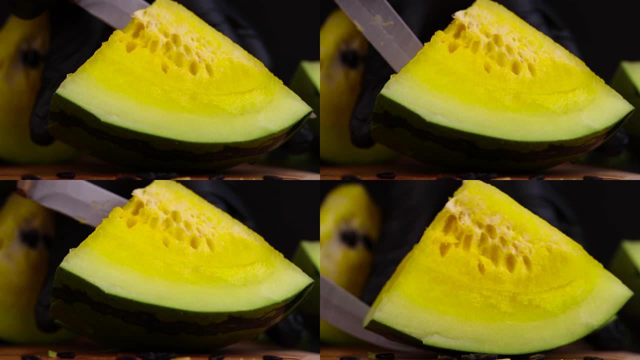 将多汁的黄色西瓜切成小块，切成黄色西瓜边缘的一部分