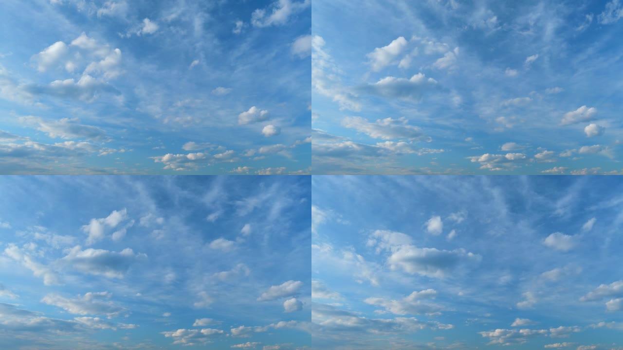 蓬松的分层云天空大气。雄伟惊人的蓝天，云彩。白色和蓝色。时间流逝。
