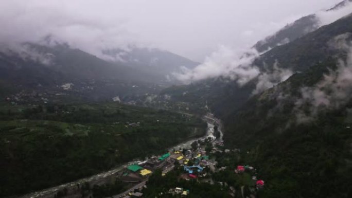 Forest and towns of Himalayas, clouds and fog, aer