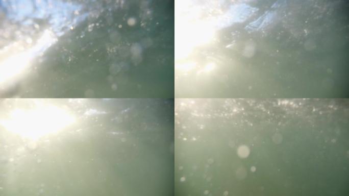 水中有气泡。阳光下闪烁的水泡。专注于泡沫。不同形式和形状的气泡在水中。完美的背景。版本2