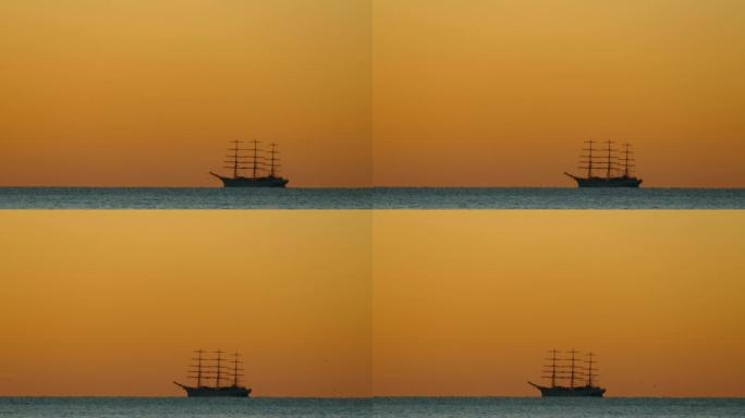背景-日落时大海中一艘高船的轮廓