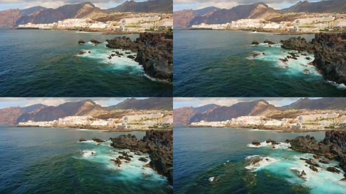 特内里费加那利岛魔鬼岩石火山海滩上的天然海洋游泳池。夏科·埃尔·暗黑破坏神。黑色冰冻熔岩流火山岩的景