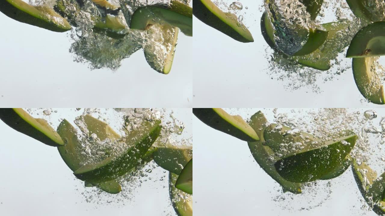 鳄梨碎片以超慢动作飞溅液体特写。维生素蔬菜