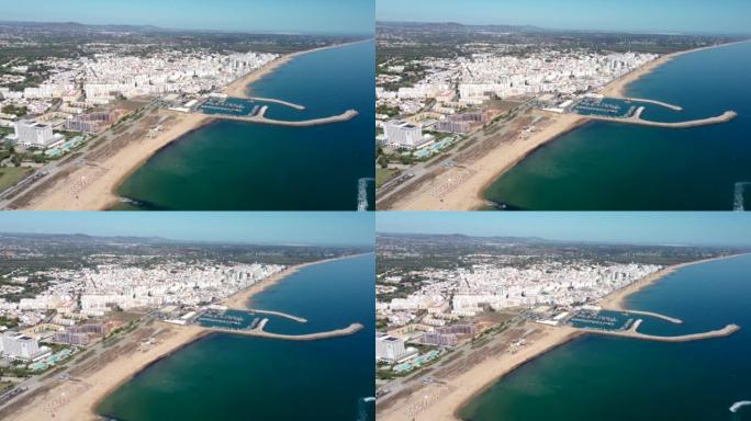葡萄牙维拉莫拉。维拉摩拉海滩的电影鸟瞰图，配有豪华酒店和城市化。